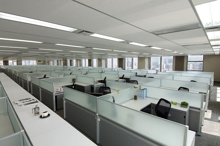 Large work stations with individual cubicles.